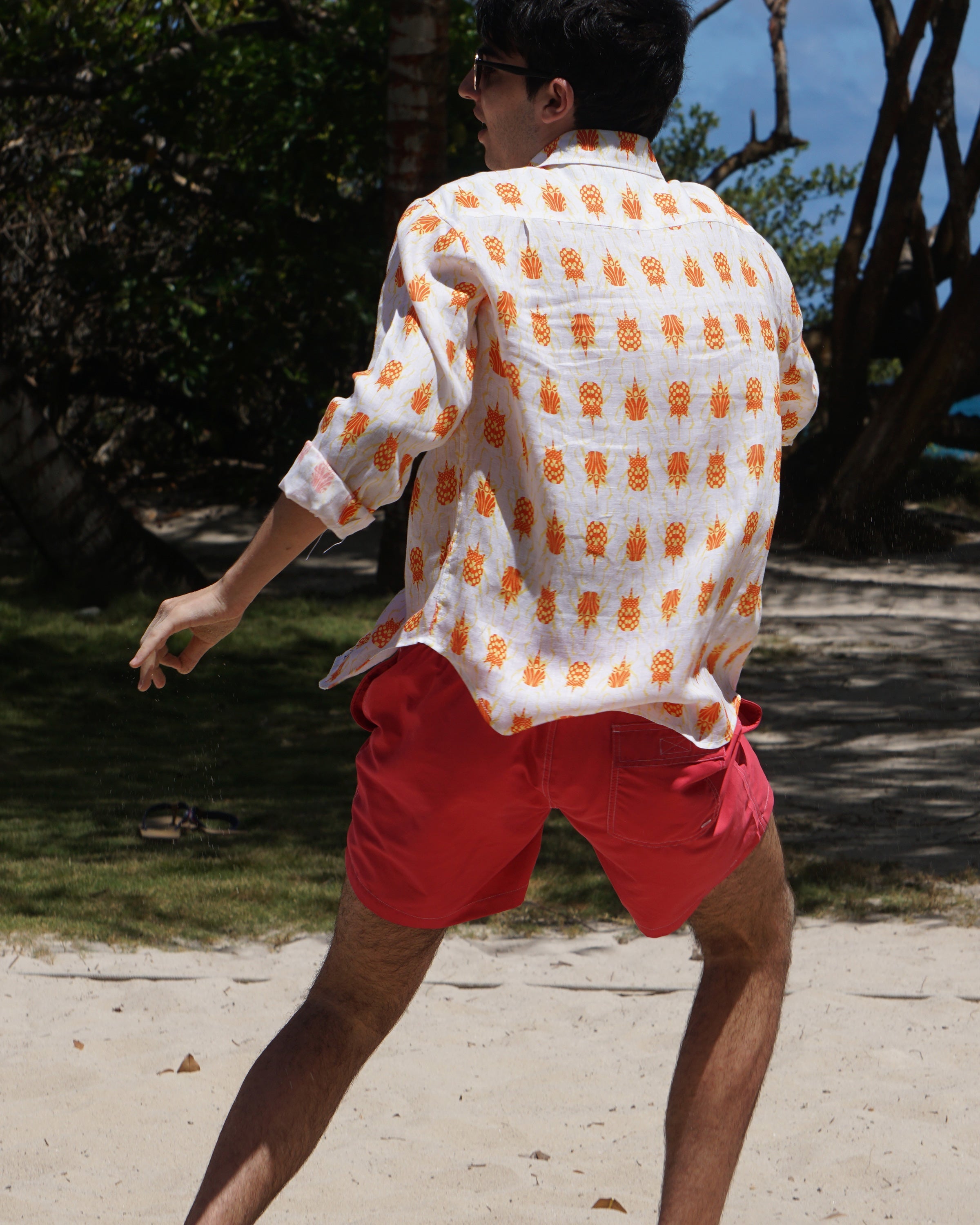 Beach vacation linen shirt in orange and yellow Beetle print by Lotty B