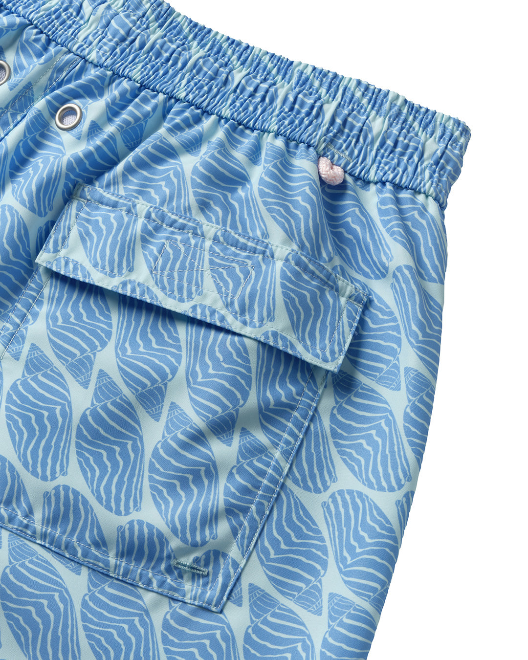 Back pocket detail of men's swim shorts in blue Striped Shell print, recycled fabric by Pink House 