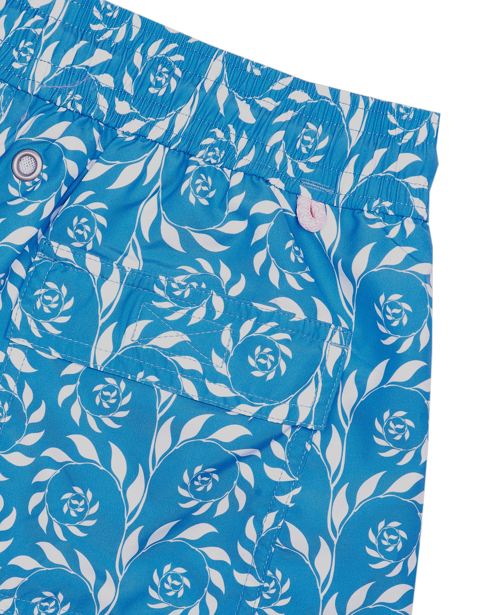 Back pocket detail of mens swim shorts in turquoise blue Fern print by Pink House