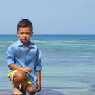 Boys blue linen shirts for kids by designer Lotty B Mustique children's beach holiday clothes