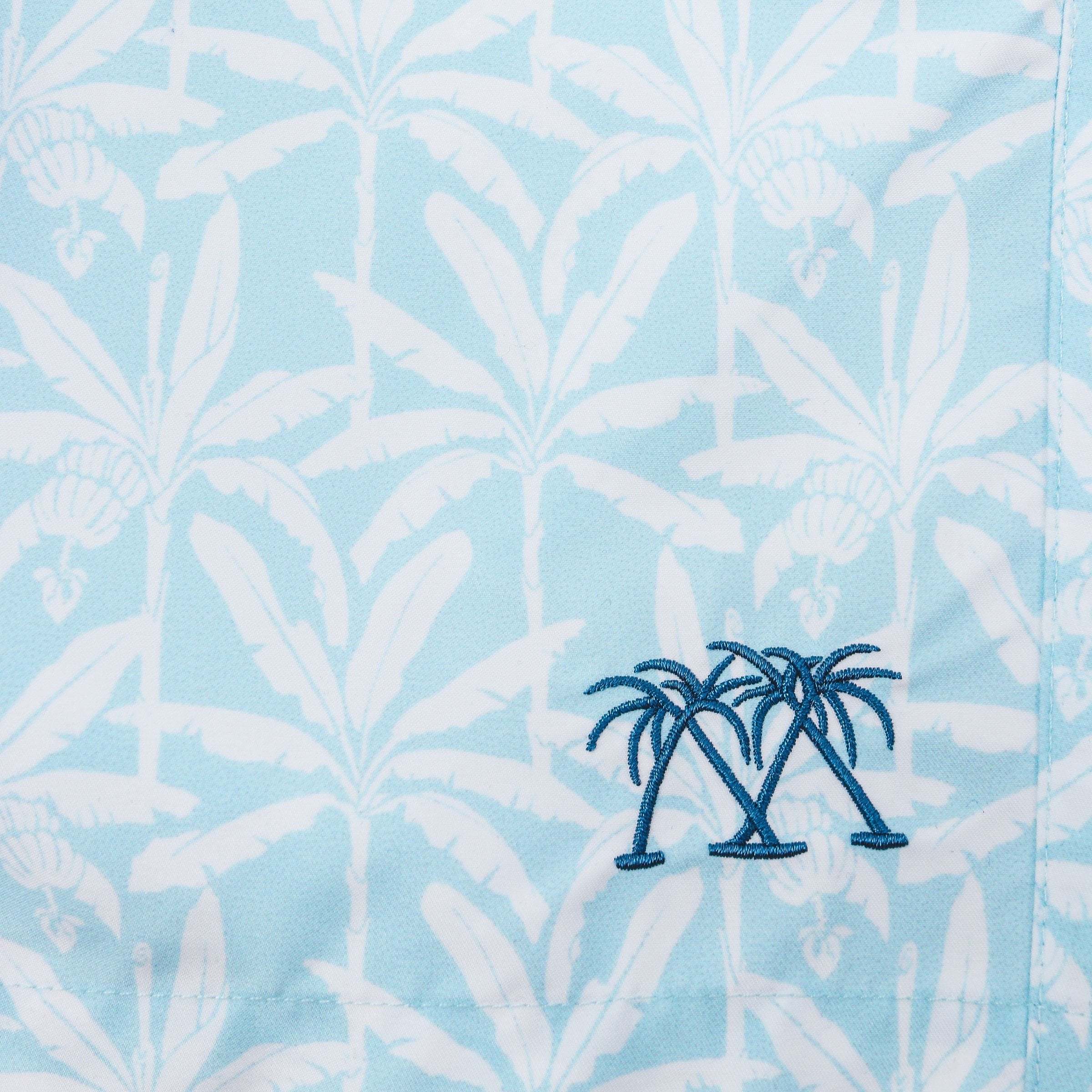 Boys swim trunks : BANANA TREE - PALE BLUE print swatch & emblem, designer Lotty B for Pink House Mustique Caribbean Kids style