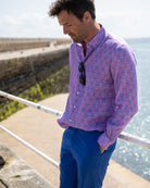 Beach style linens, dazzling blue pants worn with pink and blue shelltop linen shirt. Resortwear by Pink House 