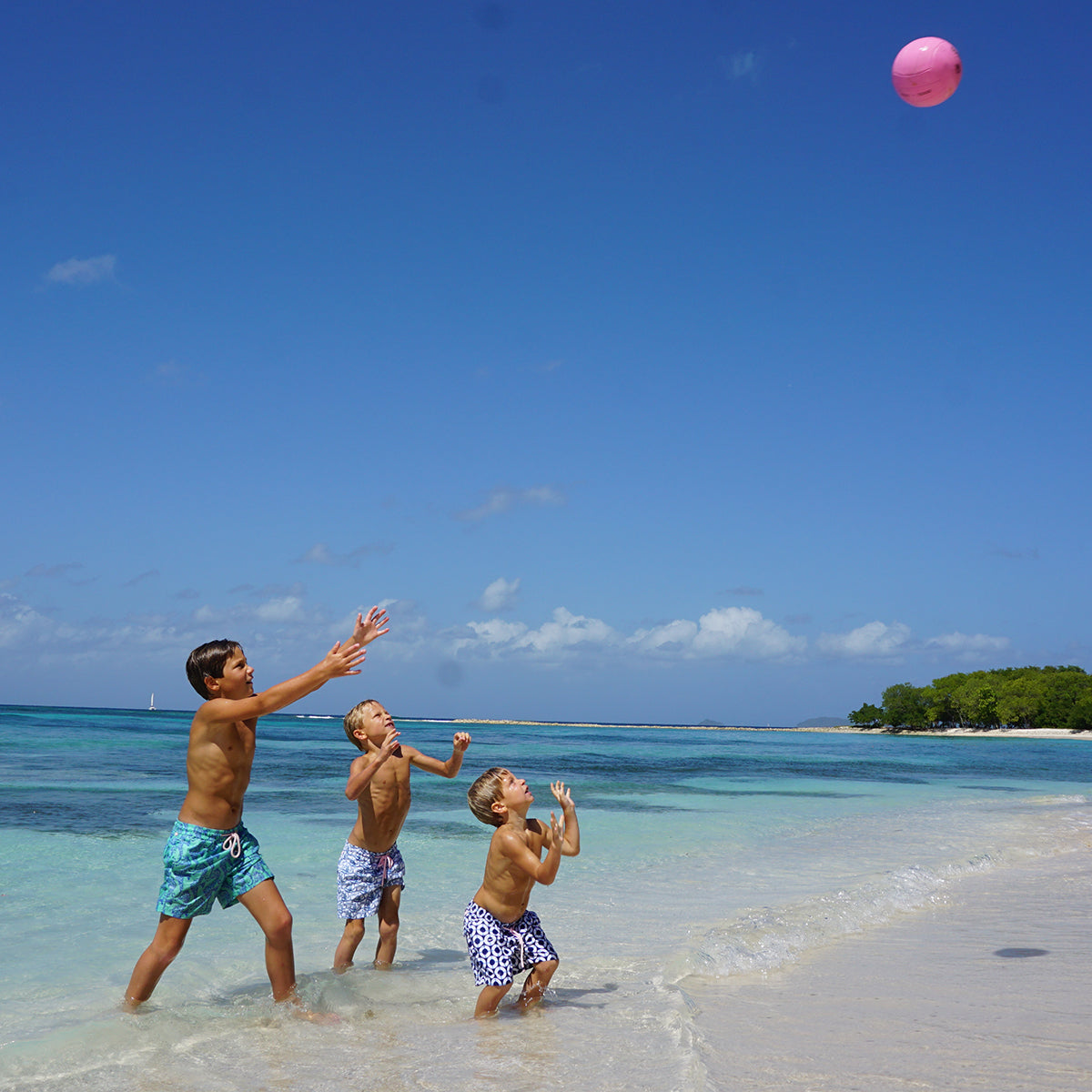 Navy blue Boys swim shorts in Life Ring print by designer Lotty B, Caribbean family resortwear