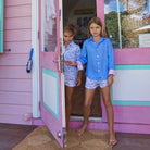 Childrens Linen Shirt: FRENCH BLUE Girls shopping at the Pink House boutique on Mustique