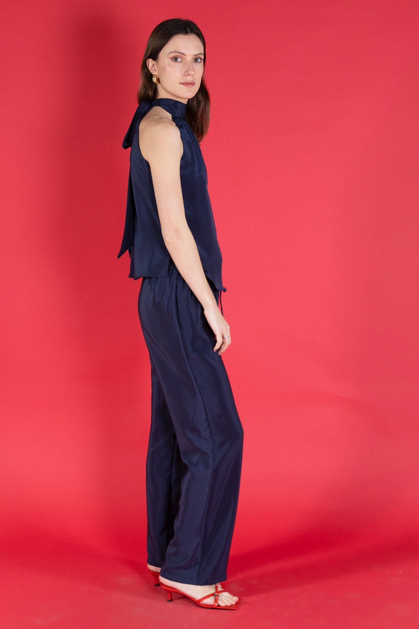 Elegant pure silk Marina trousers in navy crepe de Chine worn with halterneck Olivia top from Pink House Atelier Collections - handmade made to order 