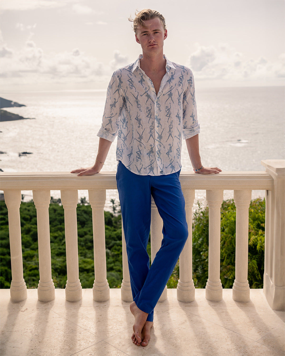 Designer dazzling blue comfortable stretch linen pants worn with blue fruit punch linen shirt. Resortwear by Pink House 