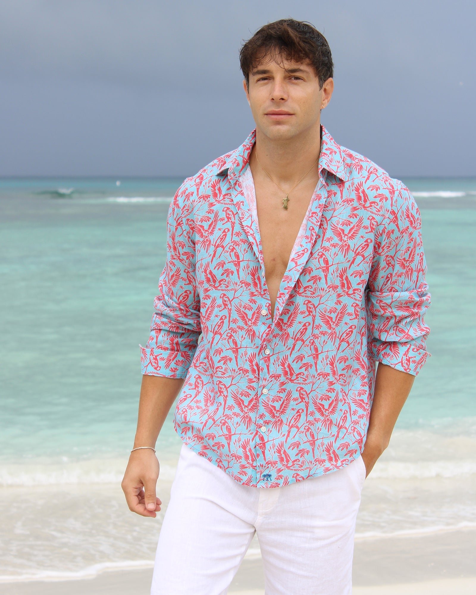 Beach vacation men's linen shirt in coral and turquoise Parrot print designer Lotty B Mustique