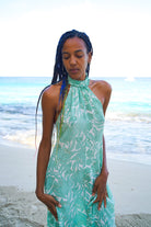 slinky silk halter neck Dena dress in green Protea print by Lotty B Mustique