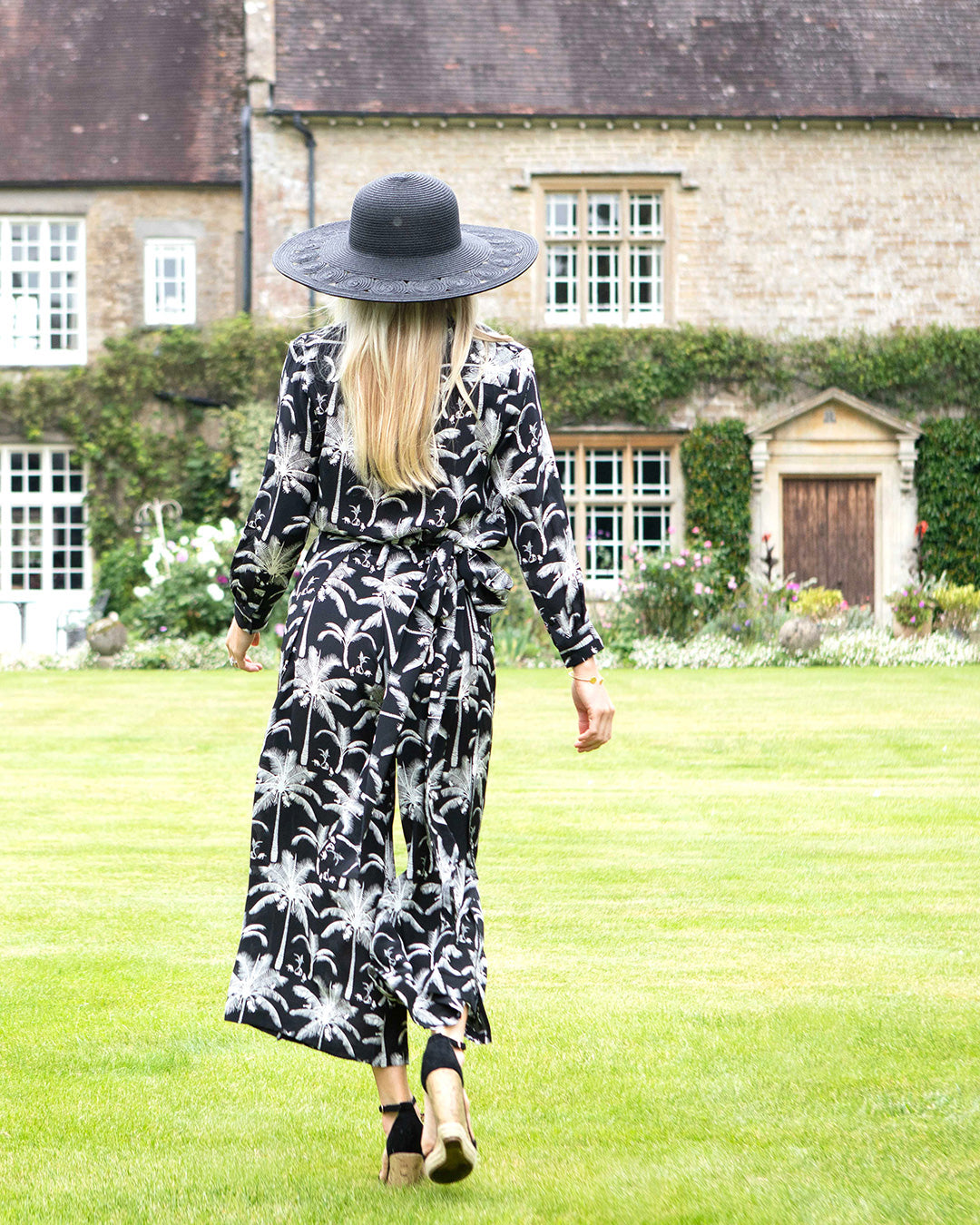 Women's occasionwear pure silk outfit. Kim blouse and palazzo pants ensemble in black and white Plantation print by designer Lotty B for Pink House