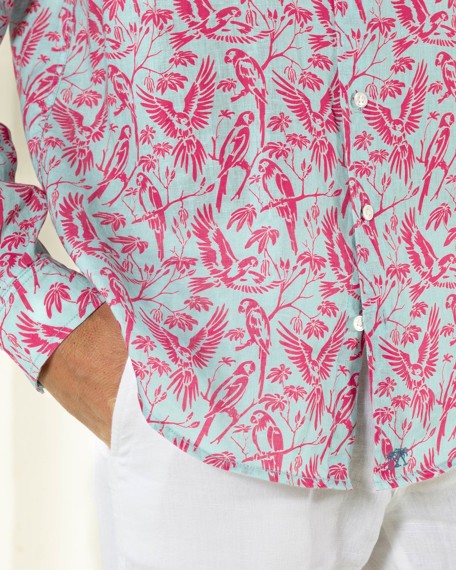 Luxury men's linen shirt in coral and turquoise Parrot print designer Lotty B Mustique