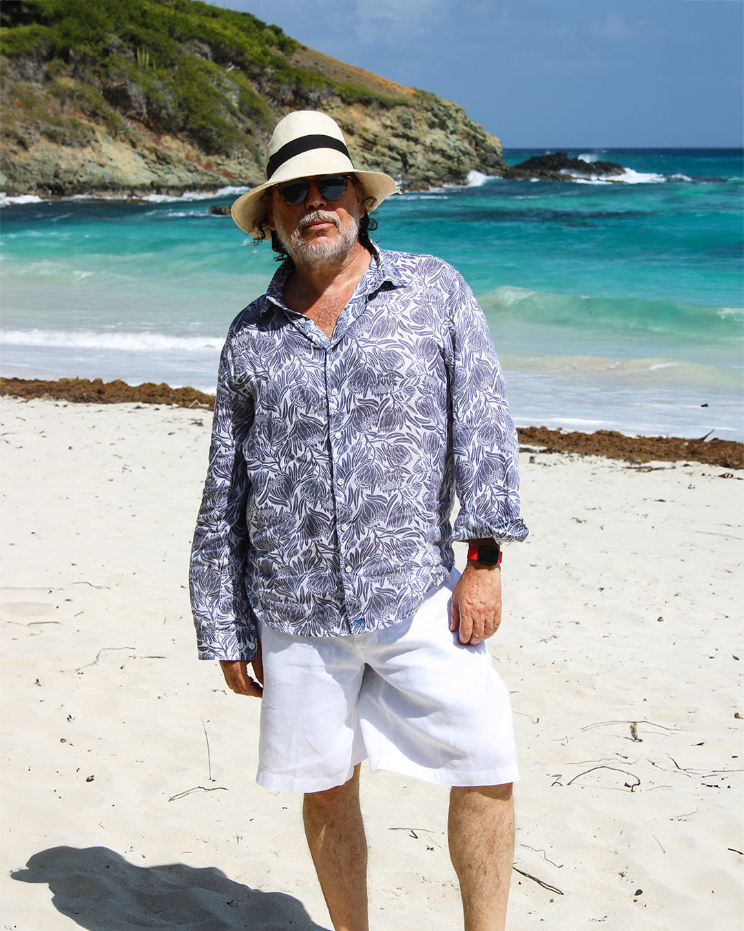 Luxury beach style mens white linen shorts worn with floral protea linen shirt by Pink House, Mustique island