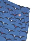 Swim trunks made to last from recycled fabric in holiday prints by Lotty B Mustique