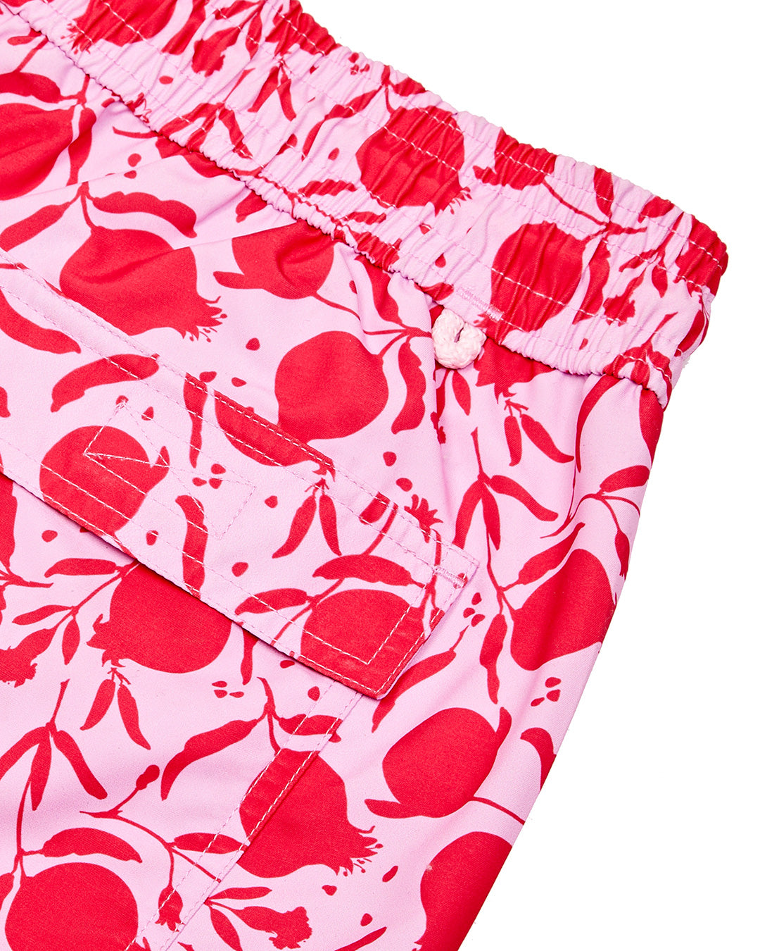 Back pocket and waistband detail on men's recycled swim shorts in pink Pomegranate print by Lotty B for Pink House