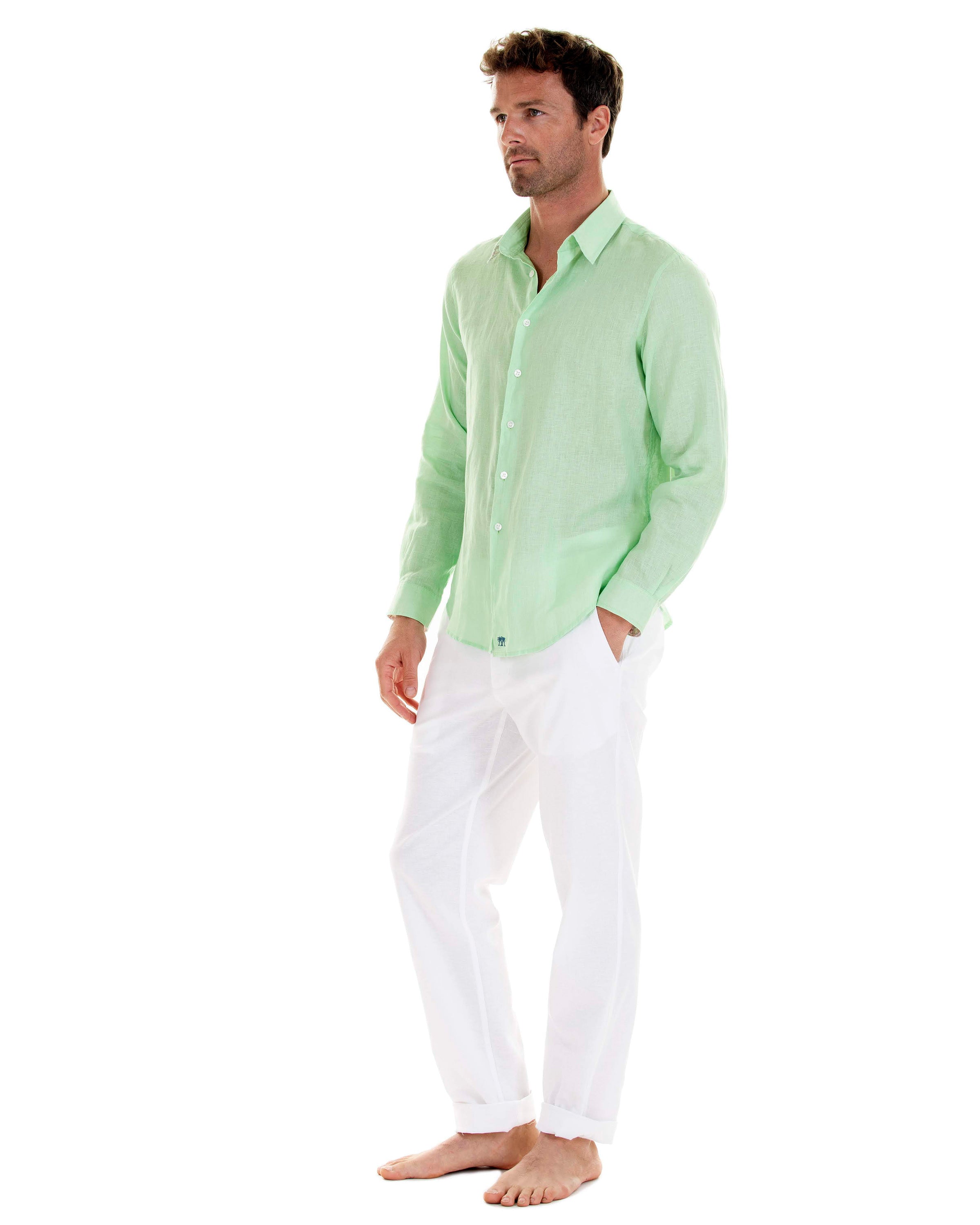 Mens green casual shirt worn with white linen trousers by designer Lotty B for Pink House Mustique 