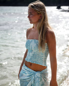 Luxury resort style silk bandeau top in Turtle aqua blue print & matching sarong by designer Lotty B Mustique 