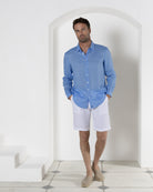 Mens quality vacation style plain white linen beach shorts worn with French blue linen shirt by Pink House