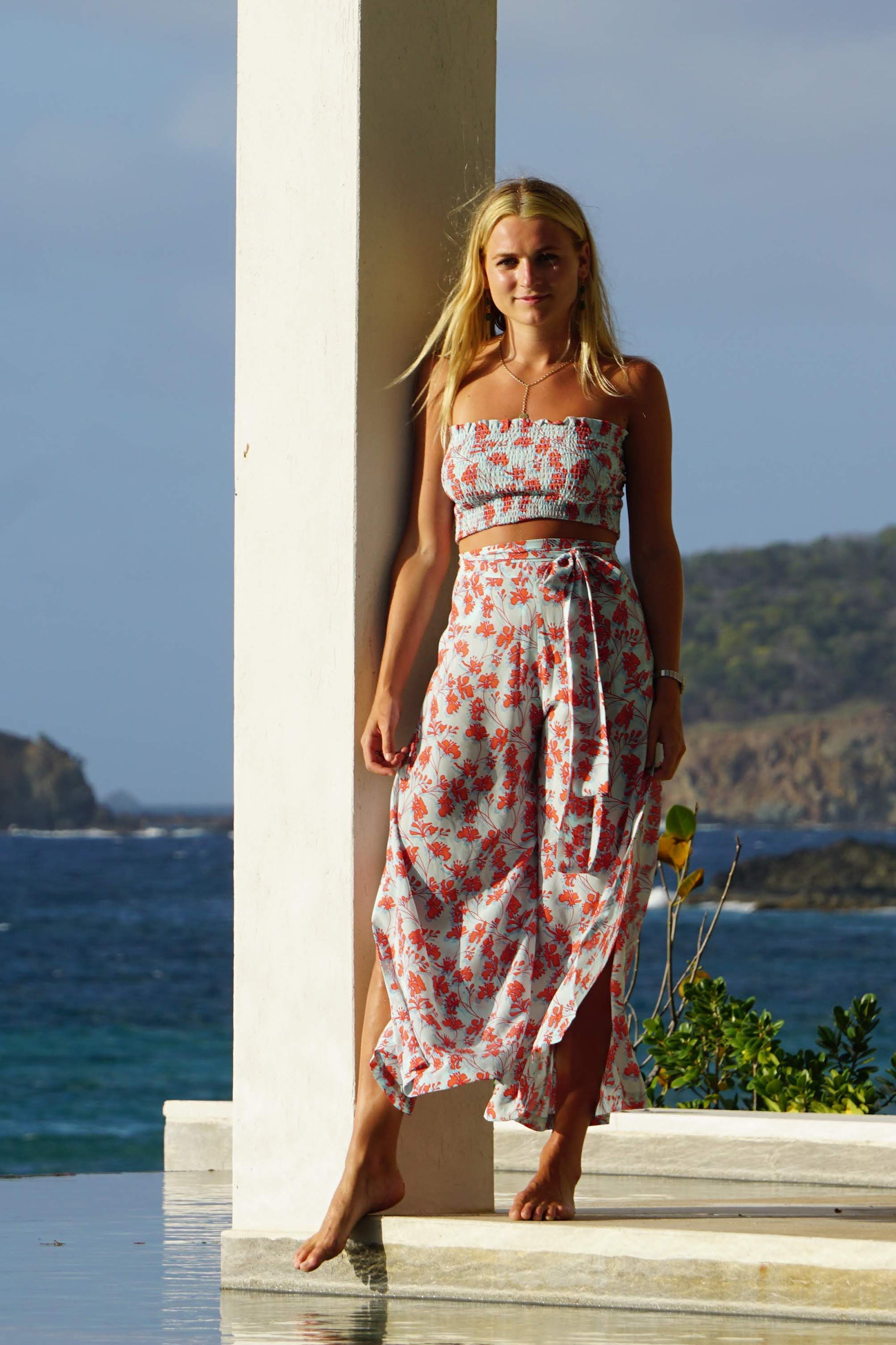 Silk Gabija Palazzo Pants: FLAMBOYANT FLOWER - ORANGE wide leg trousers designed by Lotty B Mustique resort fashion