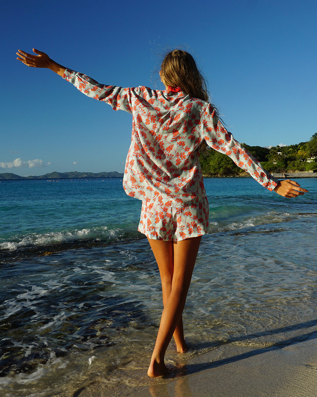 Womens summery silk Kim blouse in floral Flamboyant Flower Orange print worn together with bed-to-beach shorts by designer Lotty B for Pink House